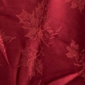 Tablecloth Burgundy round 67 inch with leaves never used. Excellent condition.